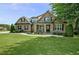 Beautiful brick home with lush lawn and well-manicured landscaping, offering great curb appeal at 39 Wood Stork Ct, Clayton, NC 27520