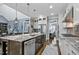 Spacious kitchen with granite countertops, stainless steel appliances, and adjacent living spaces at 39 Wood Stork Ct, Clayton, NC 27520