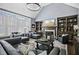 Spacious living room with built-in shelves, fireplace, and large windows for a bright, airy feel at 39 Wood Stork Ct, Clayton, NC 27520