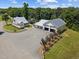A birds-eye view shows a home with garage/workshop, fenced yard and a long gravel driveway at 4050 Culbreth Rd, Stem, NC 27581