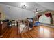 Large bonus room featuring hardwood floors, a desk area and a bedroom at 4050 Culbreth Rd, Stem, NC 27581