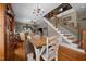 Eat-in dining room features hardwood floors, a chandelier, and a staircase to the second floor at 4050 Culbreth Rd, Stem, NC 27581