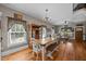 Charming eat-in dining room features hardwood floors and is open to the living room at 4050 Culbreth Rd, Stem, NC 27581