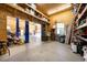 Spacious garage featuring ample storage, a car lift, and large open area at 4050 Culbreth Rd, Stem, NC 27581
