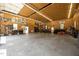 Expansive garage space with car lift, storage, and multiple entry points at 4050 Culbreth Rd, Stem, NC 27581
