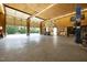 Large garage with a car lift, open doors, and potential workspace at 4050 Culbreth Rd, Stem, NC 27581