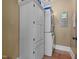 Well-organized laundry room with washer, dryer, and ample storage space at 4050 Culbreth Rd, Stem, NC 27581