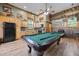 Recreation room featuring a full kitchen, wood cabinets and a billiards table for entertainment at 4050 Culbreth Rd, Stem, NC 27581
