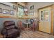 Inviting sitting area with a comfortable chair and a table near the window at 4050 Culbreth Rd, Stem, NC 27581