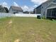 A spacious, grassy backyard surrounded by a white vinyl fence, providing privacy and room to play at 4108 Cross Timber Ln, Raleigh, NC 27603