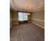 Bright dining room with carpet and decorative chair rail molding at 421 Braxman Ln, Holly Springs, NC 27540