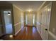 Inviting foyer with hardwood floors and plenty of natural light at 421 Braxman Ln, Holly Springs, NC 27540