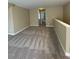 Loft living area showcasing plush carpeting and a neutral color palette at 421 Braxman Ln, Holly Springs, NC 27540