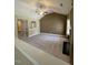 Spacious living room featuring carpeted floors, fireplace, and ample natural light at 421 Braxman Ln, Holly Springs, NC 27540