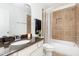 Bathroom showcasing a shower and tub, along with a granite-topped vanity at 4228 Fawn Lily Dr, Wake Forest, NC 27587
