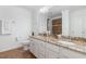 Bright bathroom featuring a granite countertop, dual sinks, and a walk-in shower with decorative tile at 4228 Fawn Lily Dr, Wake Forest, NC 27587