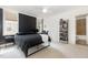 Bedroom with black accent wall, neutral carpet, and en suite bathroom at 4228 Fawn Lily Dr, Wake Forest, NC 27587