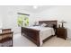 Bedroom with hardwood furniture, ample lighting, and a window view of the outdoors at 4228 Fawn Lily Dr, Wake Forest, NC 27587