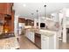 Open kitchen featuring granite countertops, stainless steel appliances, and eat-in bar at 4228 Fawn Lily Dr, Wake Forest, NC 27587