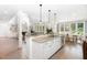 Gourmet kitchen with a center island, stainless steel appliances and an open concept view to living room at 4228 Fawn Lily Dr, Wake Forest, NC 27587