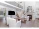 Spacious living room with hardwood floors, a fireplace, and a view of the staircase at 4228 Fawn Lily Dr, Wake Forest, NC 27587