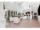 Open-concept living space with hardwood floors, a fireplace, and access to the kitchen at 4228 Fawn Lily Dr, Wake Forest, NC 27587