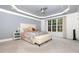 Large main bedroom showcasing a decorative ceiling, large window, and comfortable furnishings at 4228 Fawn Lily Dr, Wake Forest, NC 27587