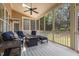 Relaxing screened porch with comfortable seating and a view of the backyard at 4228 Fawn Lily Dr, Wake Forest, NC 27587