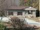 Charming home featuring neutral siding, shutters, and a gravel driveway at 4254 Bowmantown Rd, Roxboro, NC 27574