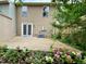 A backyard with a wooden deck, small trees and flowers at 4324 Halliwell Dr, Raleigh, NC 27606