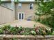 Inviting backyard with a spacious wooden deck surrounded by vibrant flowerbeds and well-kept landscaping, great for entertaining at 4324 Halliwell Dr, Raleigh, NC 27606