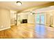 Finished basement featuring a fireplace, ample lighting, and wood-look floors at 4324 Halliwell Dr, Raleigh, NC 27606