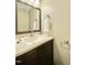 Powder room featuring a vanity with a granite countertop and a decorative mirror at 4324 Halliwell Dr, Raleigh, NC 27606