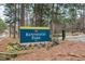 Entrance sign for Kentwood Park surrounded by trees and colorful flowers, offering recreational opportunities at 4324 Halliwell Dr, Raleigh, NC 27606