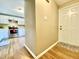 Entryway view of a kitchen featuring stainless steel appliances and white cabinets at 4324 Halliwell Dr, Raleigh, NC 27606