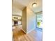 Inviting entryway featuring wood-look flooring with a view of the kitchen with stainless steel appliances at 4324 Halliwell Dr, Raleigh, NC 27606