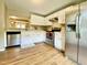 Spacious kitchen featuring stainless steel appliances, granite countertops and white cabinets at 4324 Halliwell Dr, Raleigh, NC 27606