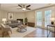 Staged living room with a modern aesthetic, including a fireplace and patio access at 4324 Halliwell Dr, Raleigh, NC 27606