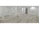 Spacious basement features modern flooring, neutral colors, and access to an outdoor area at 437 Woodsdale Rd, Roxboro, NC 27573