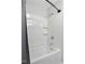 Clean bathtub with built-in shelves and a shower head at 437 Woodsdale Rd, Roxboro, NC 27573