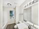Bathroom features modern white vanity and bright lights to ensure you look your best at 448 Chinaberry Ln, Angier, NC 27501