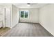 Bedroom is well-lit with natural light from the window and neutral colored carpeting at 448 Chinaberry Ln, Angier, NC 27501