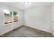 Cozy bedroom with neutral carpet and a large bright window with views to exterior at 448 Chinaberry Ln, Angier, NC 27501