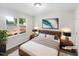 Comfortable bedroom featuring a plush bed, stylish decor, and a large bright window at 448 Chinaberry Ln, Angier, NC 27501