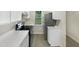 Compact kitchen featuring stainless steel appliances, white countertops, and ample lighting at 448 Chinaberry Ln, Angier, NC 27501