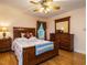 Comfortable bedroom with a wood-frame bed, dresser and nightstands with ample natural light at 45 Softwood Dr, Franklinton, NC 27525