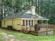 Cozy home with a deck and a well-maintained yard surrounded by trees at 45 Softwood Dr, Franklinton, NC 27525