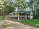 Exterior view of the home with a spacious deck and wraparound porch at 45 Softwood Dr, Franklinton, NC 27525