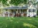 Charming home featuring a large front porch and well-maintained yard at 45 Softwood Dr, Franklinton, NC 27525