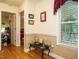 Welcoming hallway features hardwood floors, transom window, and classic decor at 45 Softwood Dr, Franklinton, NC 27525